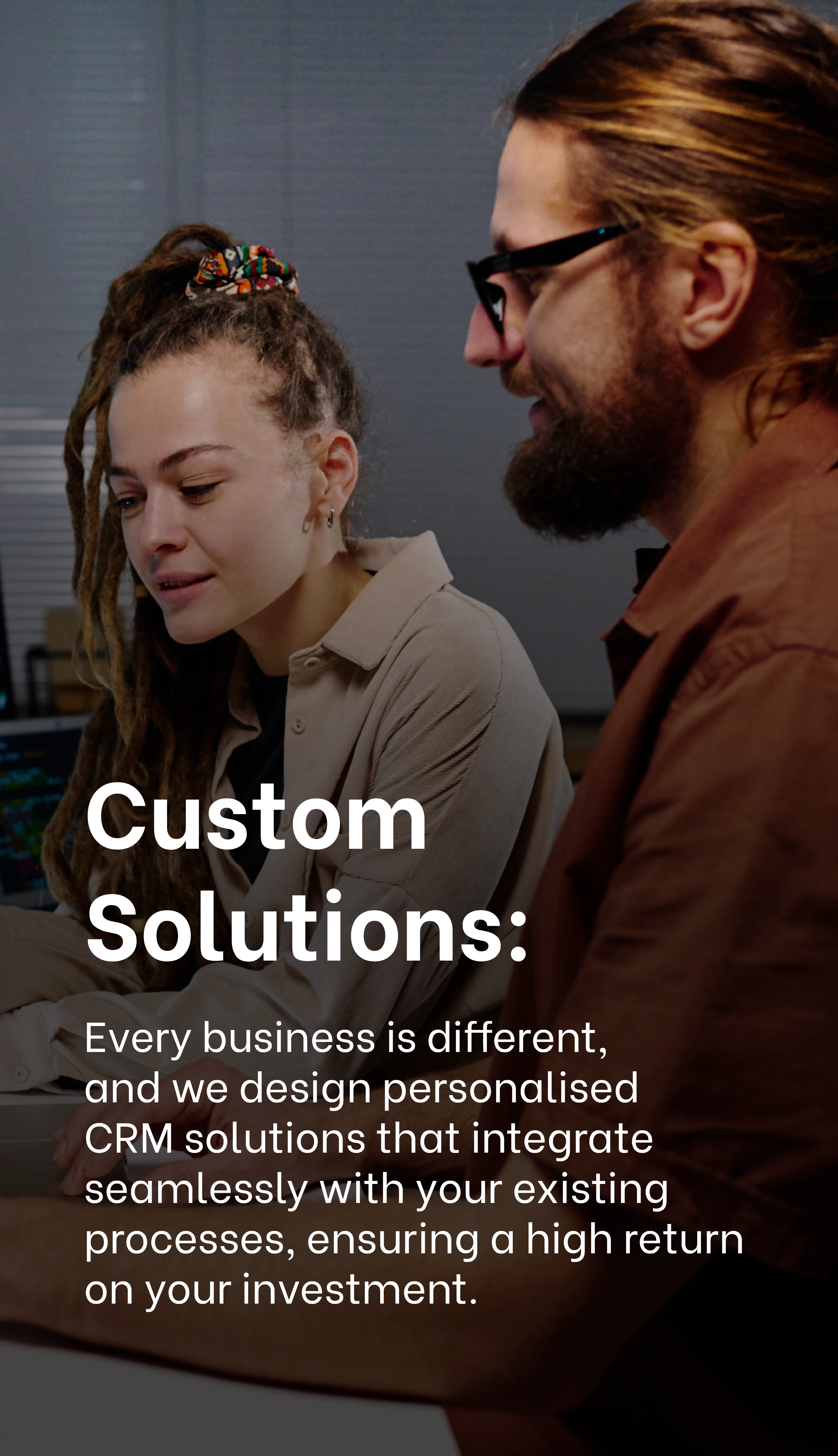 Custom Solutions: Professionals collaborating on personalized CRM solutions for businesses at Exigo Tech