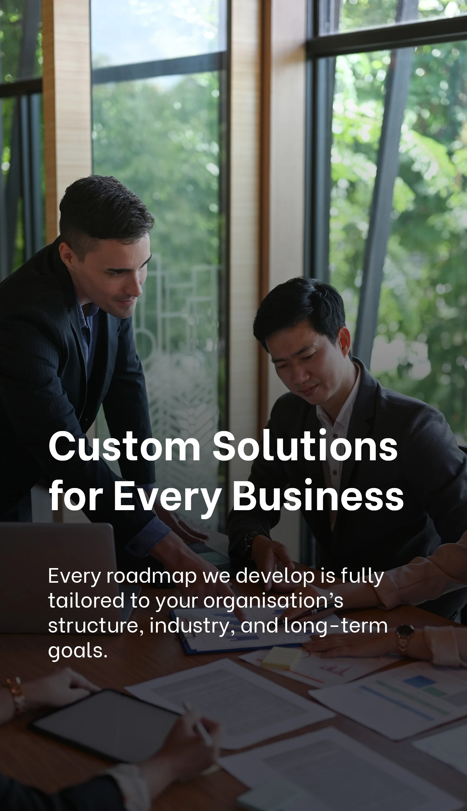 Customised Solutions | Professionals collaborating on custom business solutions at Exigo Tech